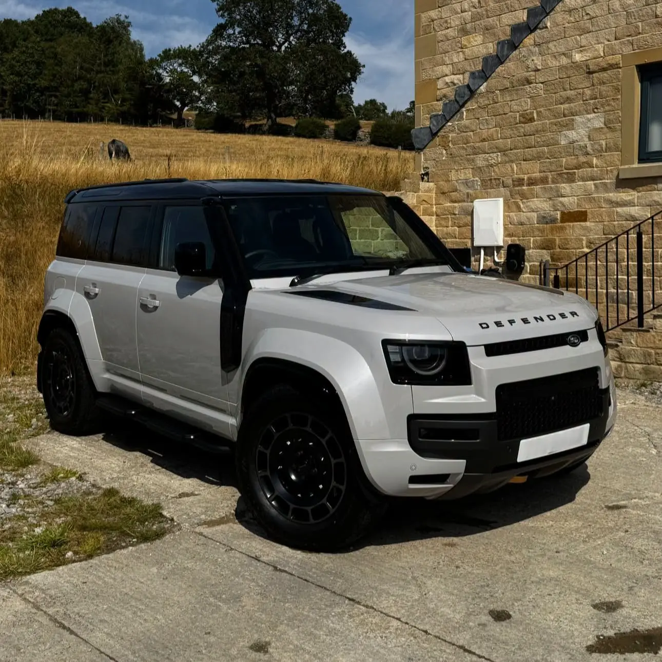 Silver Land Rover Defender after an exterior clean